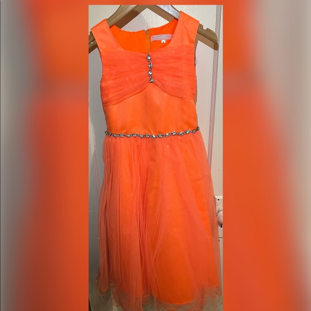 This orange elegant gown for girls is fromPink Butterfly and it’s a size 8